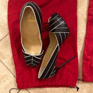Christian Louboutin peep toe platform heel.